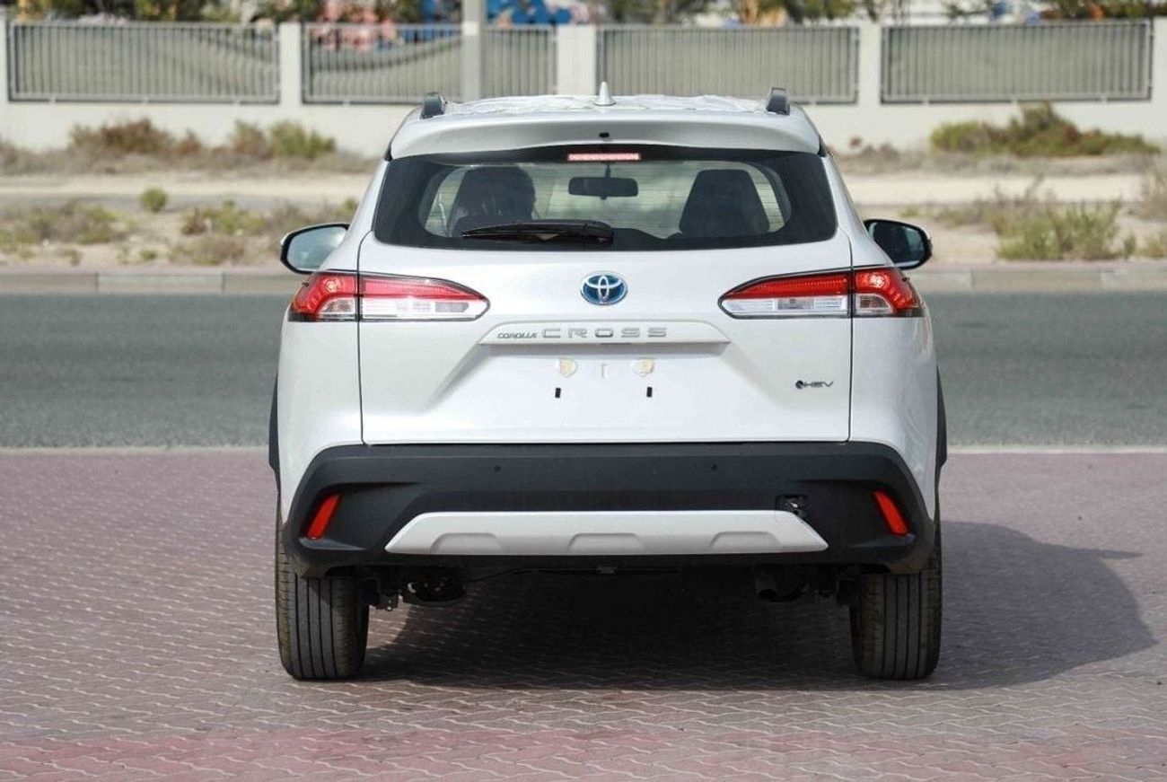 تويوتا كورولا كروس 2025 TOYOTA COROLLA CROSS MID 1.8 Hybrid - PLATINUM WHITE PEARL inside RED | Export Only