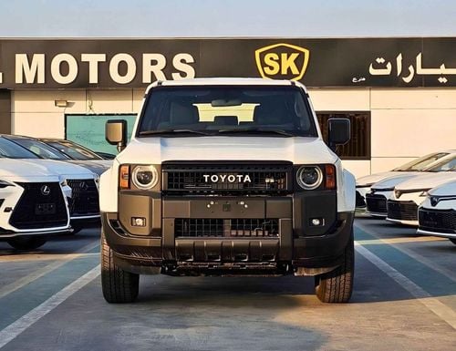 تويوتا برادو LC250 URBAN / 2.4L PETROL 4WD / DVD+CAMERA / COOL BOX / FABRIC SEATS (CODE # PR24U)