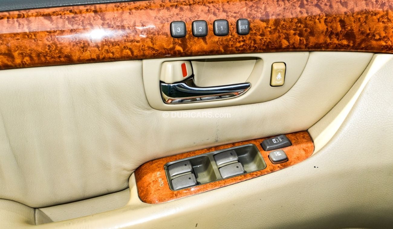 Lexus LS430 Imported 1/2 Ultra 2006 model, white color, leather opening, wooden wheels, electric mirrors, electr