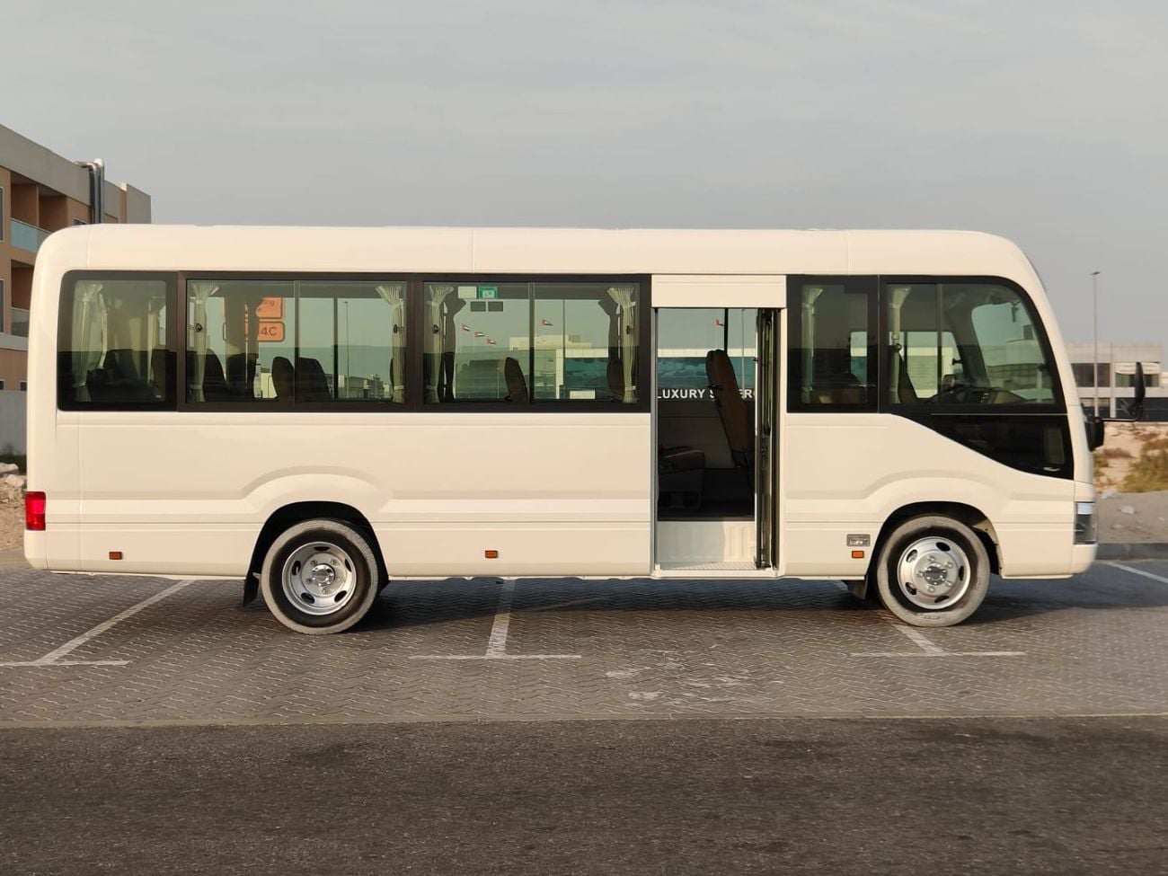 تويوتا كوستر 2025 Toyota Coaster High-Roof 23-Seater (2-Point Seatbelts) 4.0L 4-Cyl Turbo Diesel M/T RWD Export O
