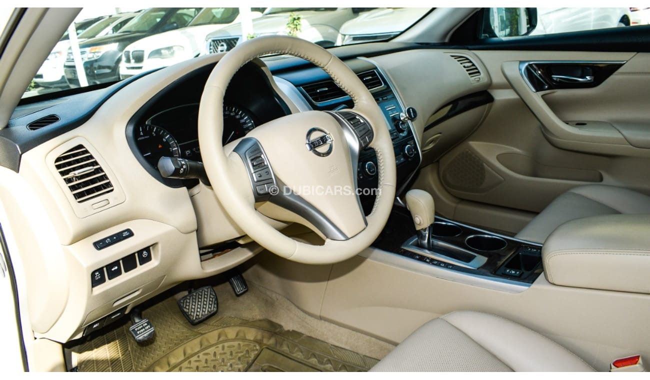 Nissan Altima White color inside Big Ward No.1 fingerprint slot, leather alloy wheels, camera screen control senso