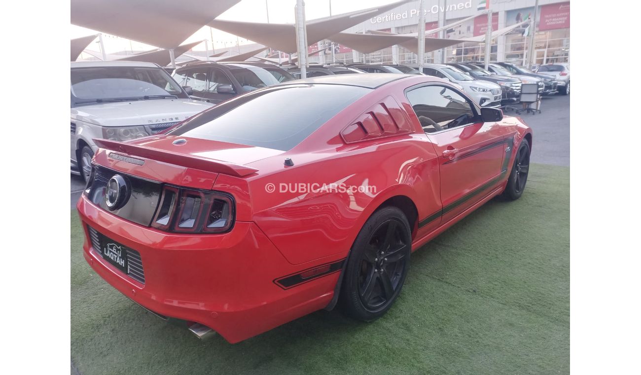 Ford Mustang 2014 GCC model, coupe, cruise control, rear camera, leather rear spoiler, in excellent condition