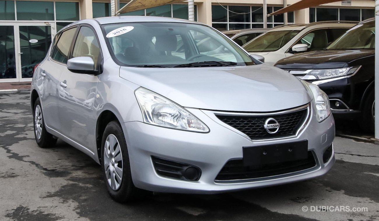 Nissan Tiida Pre-owned  for sale in Sharjah. Grey/Silver 2016 model, available at Wael Al Azzazi Shar