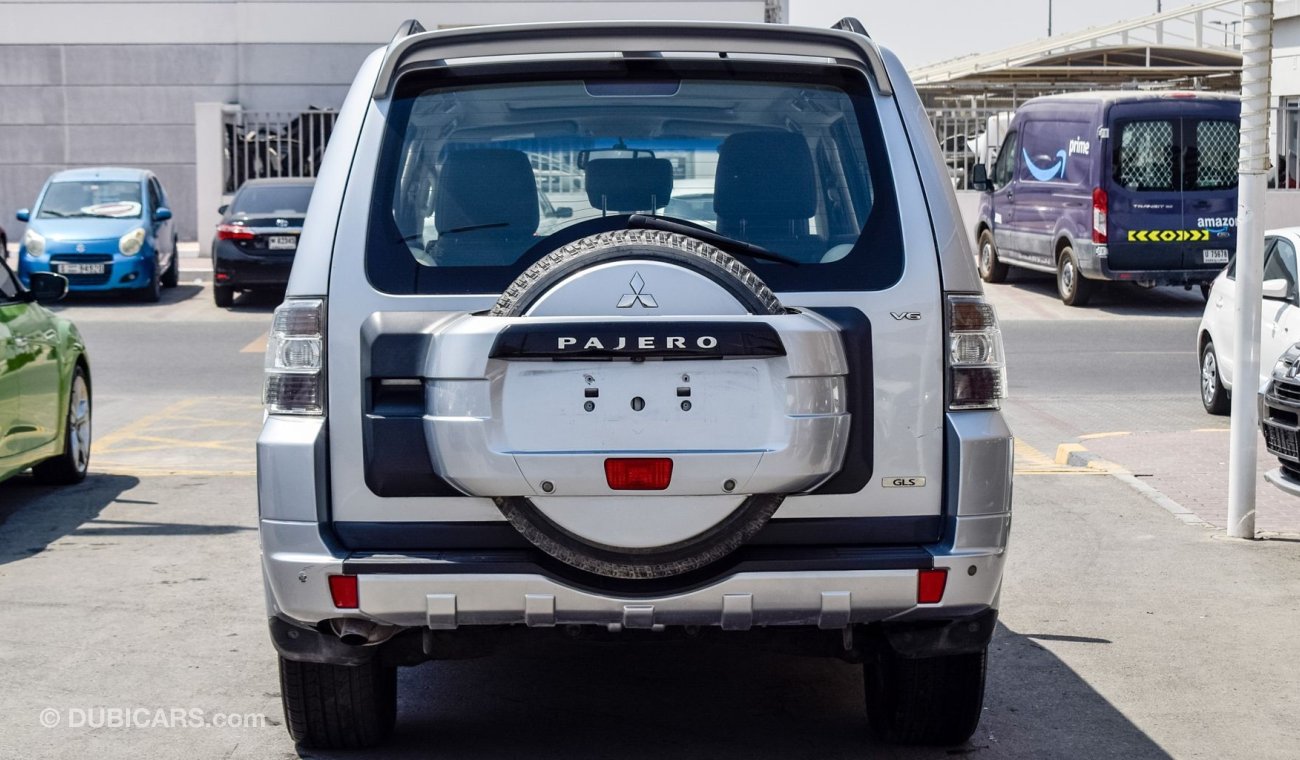 ميتسوبيشي باجيرو Pre-owned Mitsubishi Pajero GLS V6 for sale in Sharjah. Grey/Silver 2014 model, available at Wael Al