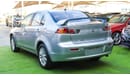 Mitsubishi Lancer 1600 CC, 2016 model, Gulf silver color, rear wing hatch, alloy wheels, FM radio, power conditioning,