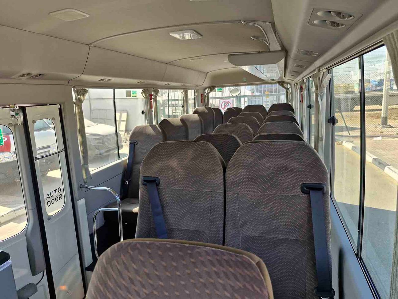 تويوتا كوستر ECTALM003 - 2025 Toyota Coaster – 2.8L Diesel Auto – 22 Seats, Cool Box