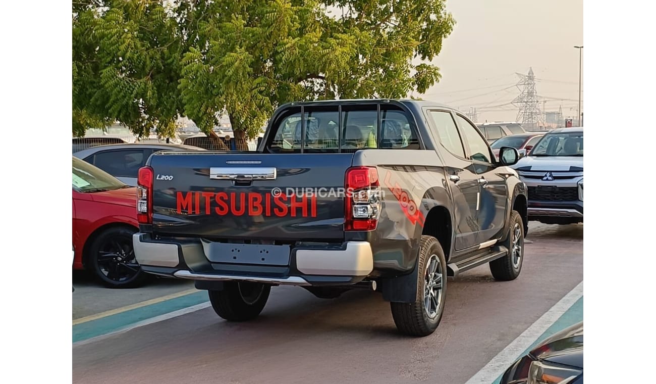 Mitsubishi L200 GLX 2.5L Diesel / M/T / 4WD / Black Rims / Streering Vol Control (Code # L2DDB)