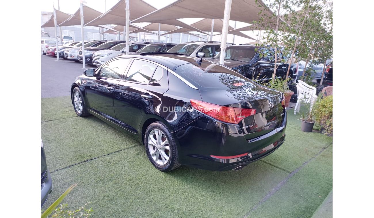 كيا أوبتيما موديل 2012 وارد أمريكى بانوراما مثبت سرعة تحكم خشب رنجات حساسات بحالة ممتازة